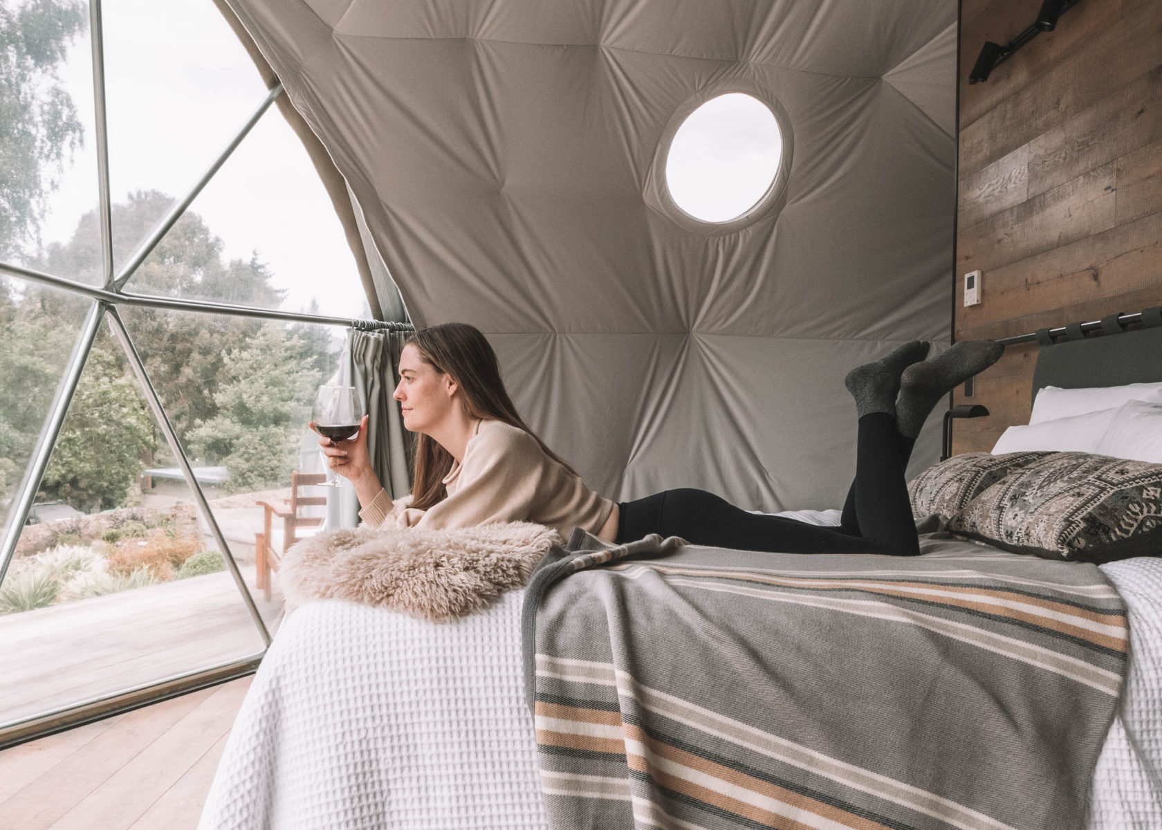 Woman on bed in Geo Dome